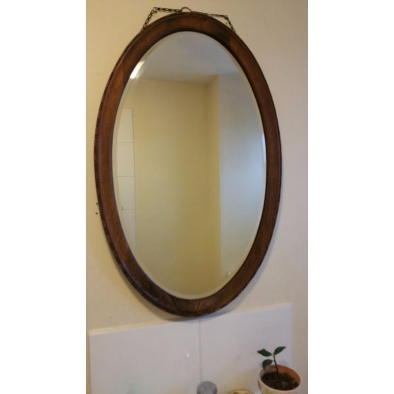 Oval large mirror with wooden border, in excellent condition, for sale
