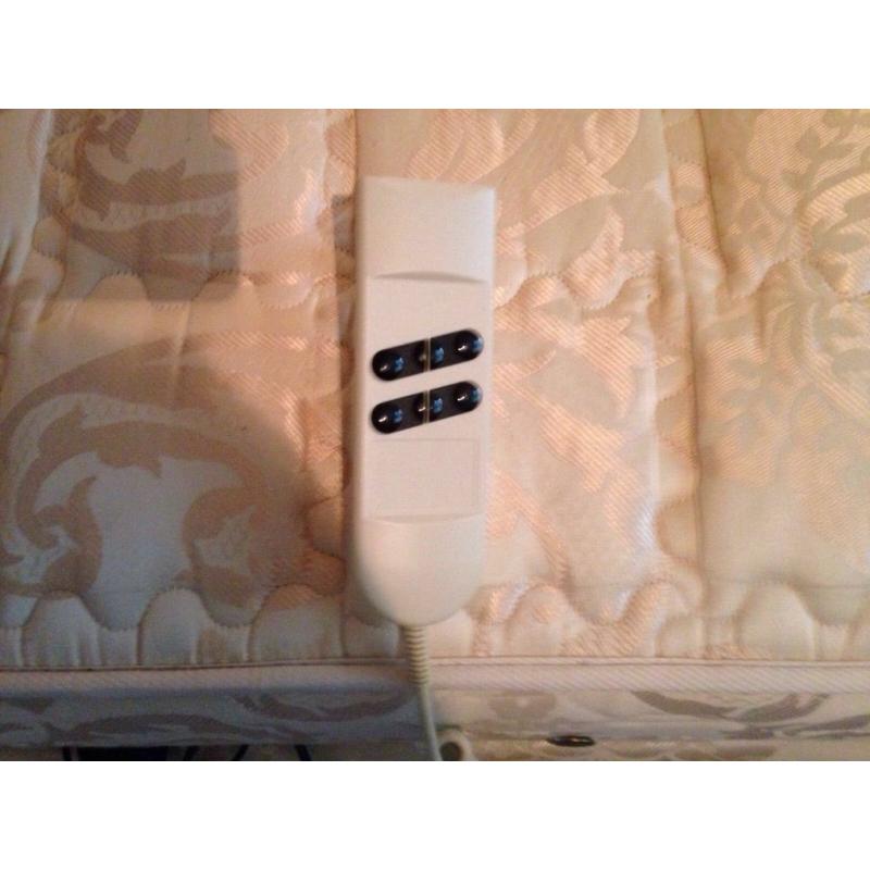 Single electric bed. Never used. Perfect working order. Wooden headboard
