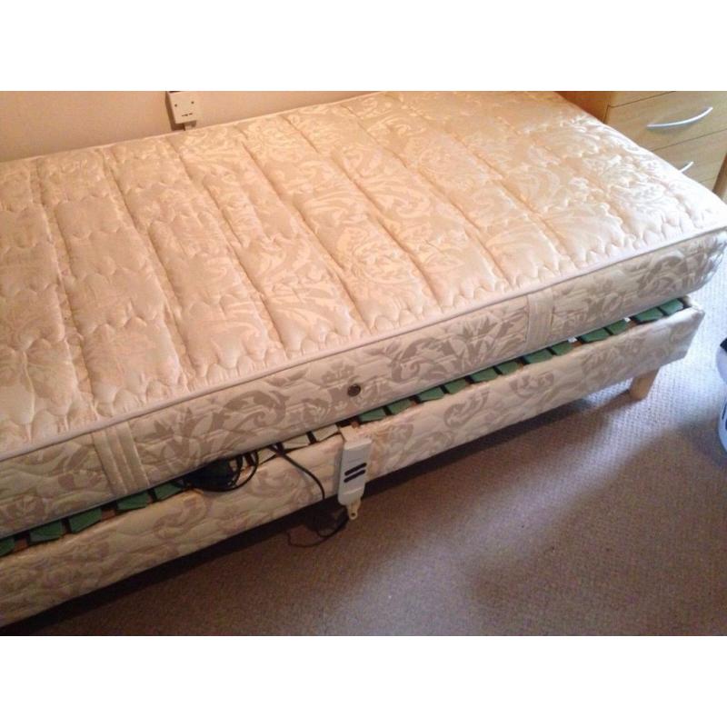 Single electric bed. Never used. Perfect working order. Wooden headboard