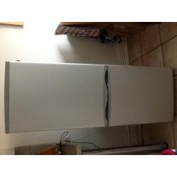 Essentials fridge/ freezer under year old in silver