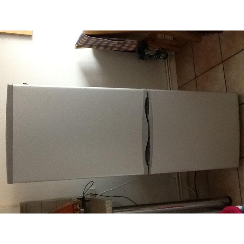 Essentials fridge/ freezer under year old in silver