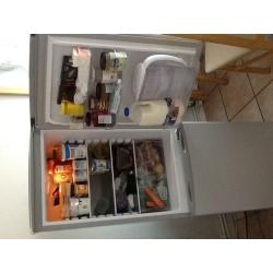 Essentials fridge/ freezer under year old in silver