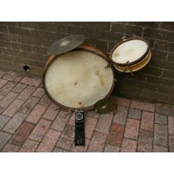 Vintage wooden childs drum kit.
