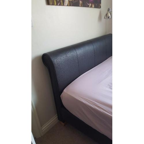 Leather Double bed in good condition with all bolts and parts