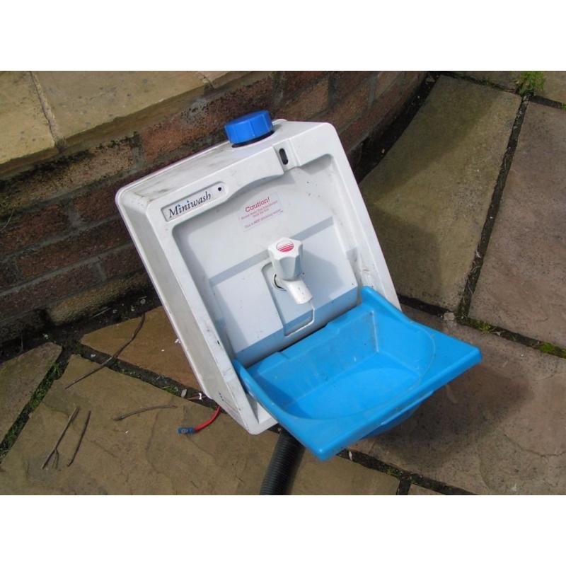 Heated water hand wash container