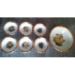 Porcelain set of bowls made in 1792. A porcelain tea set and tray, and bull China bells