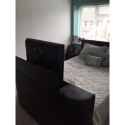 Very dark brown/black tv bed