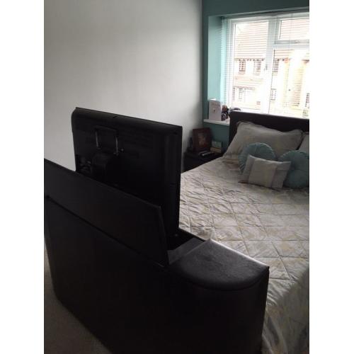 Very dark brown/black tv bed