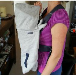 Baby Bjorn infant carrier with cold-weather hoodie.