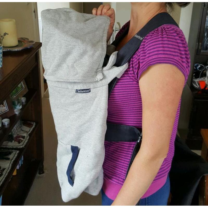 Baby Bjorn infant carrier with cold-weather hoodie.