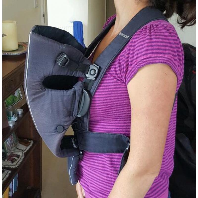 Baby Bjorn infant carrier with cold-weather hoodie.