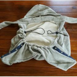 Baby Bjorn infant carrier with cold-weather hoodie.