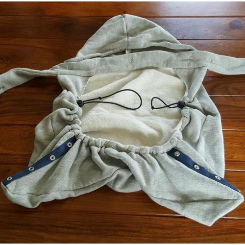 Baby Bjorn infant carrier with cold-weather hoodie.