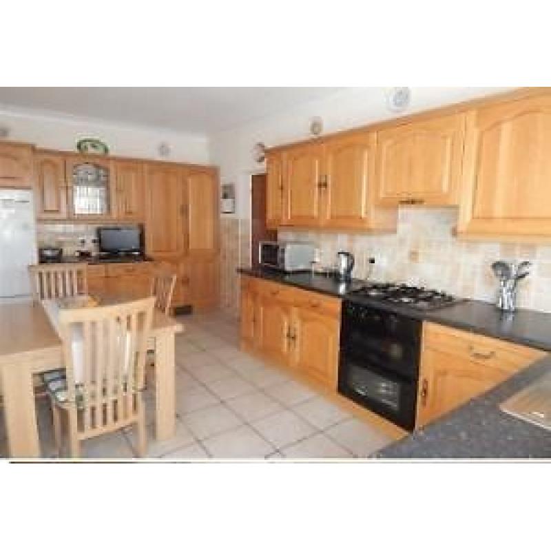 Solid oak kitchen units including electric oven and gas hob