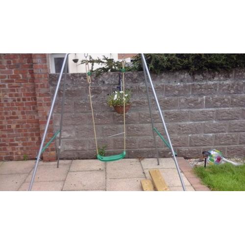 Kids Plum swing for sale. Like new. Reserved now