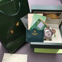 Silver Rolex YatchMaster with silver face and blue hand in Rolex bag and box
