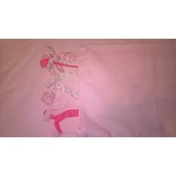 pink curtains with cute bow ties on top and pink detailing on the bottom