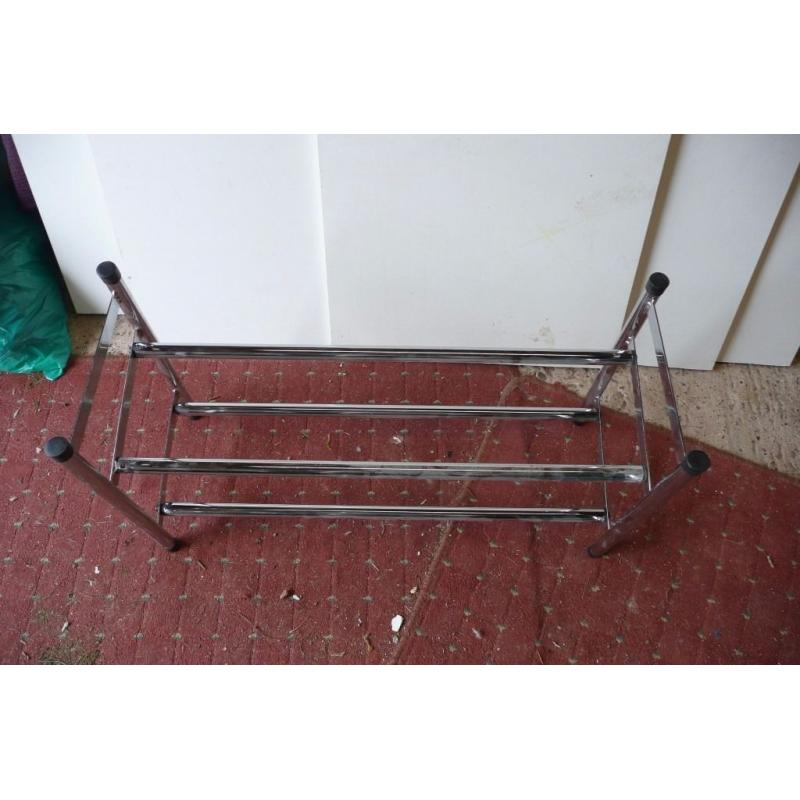 silver metal extending shoe rack.