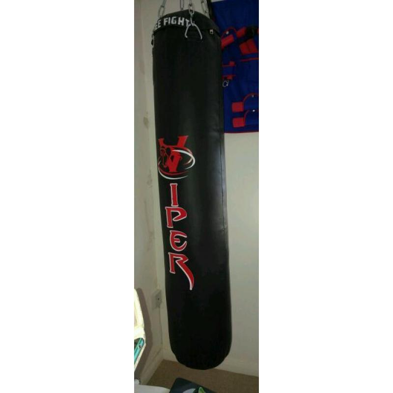 Punch bag and gloves wall mounted