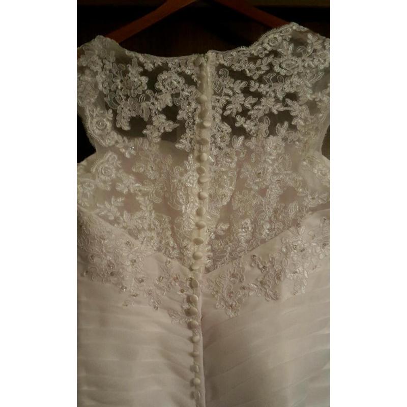 wedding dress-white. Never worn.