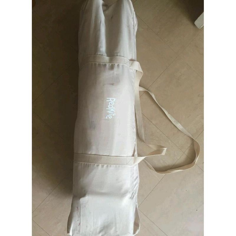 Red kite travel cot