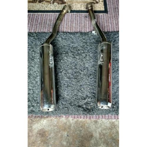 Motorcycle exhaust cans.