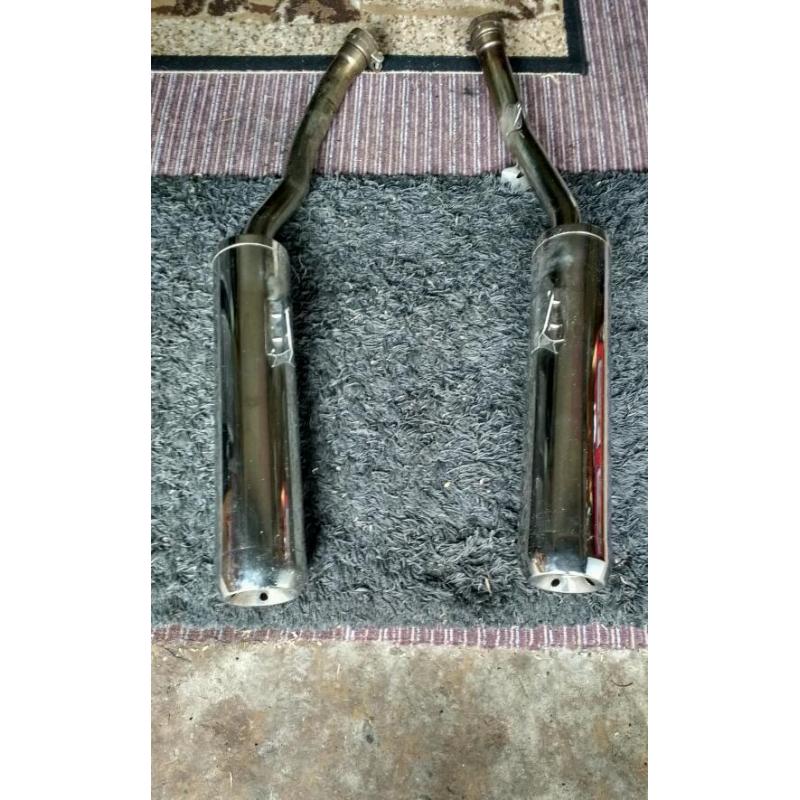 Motorcycle exhaust cans.
