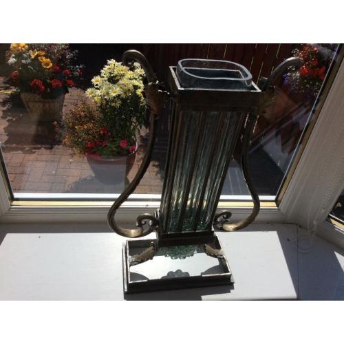Ornate bronze and glass vase.
