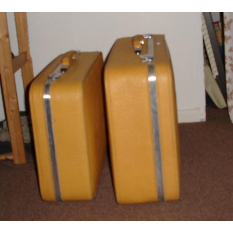 2 yellow Antler suitcases