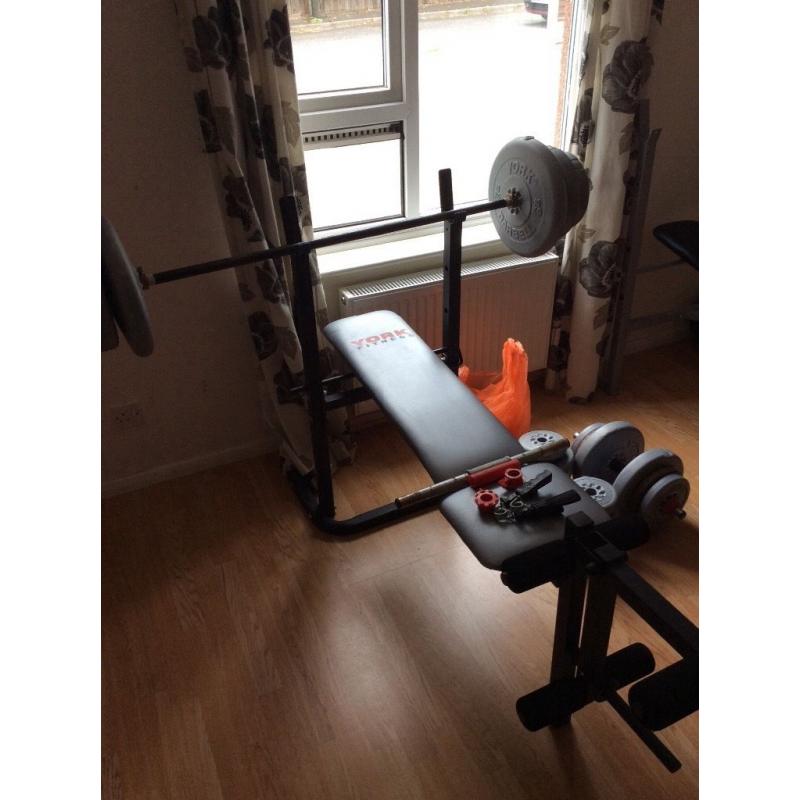 York weight bench with bar amd loads of weights