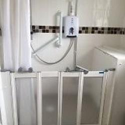 Electric shower, white Triton including overhead shower head and hose. Excellent condition.