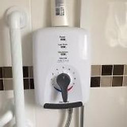 Electric shower, white Triton including overhead shower head and hose. Excellent condition.