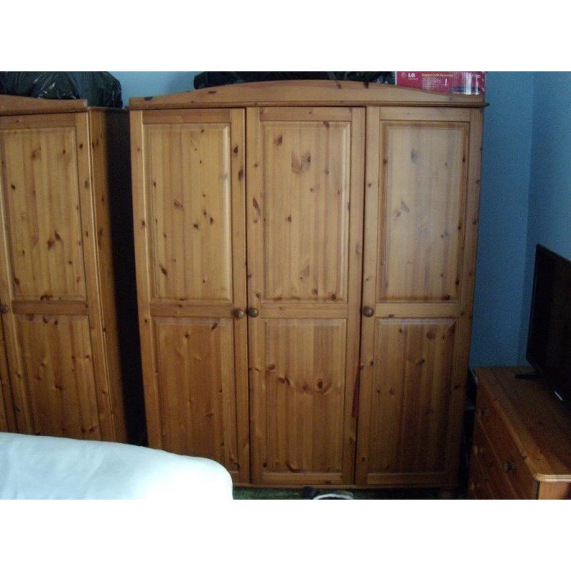 pair of pine triple wardrobes in good condition
