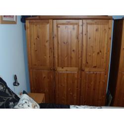 pair of pine triple wardrobes in good condition