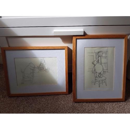 2 winnie poo drawings in frames