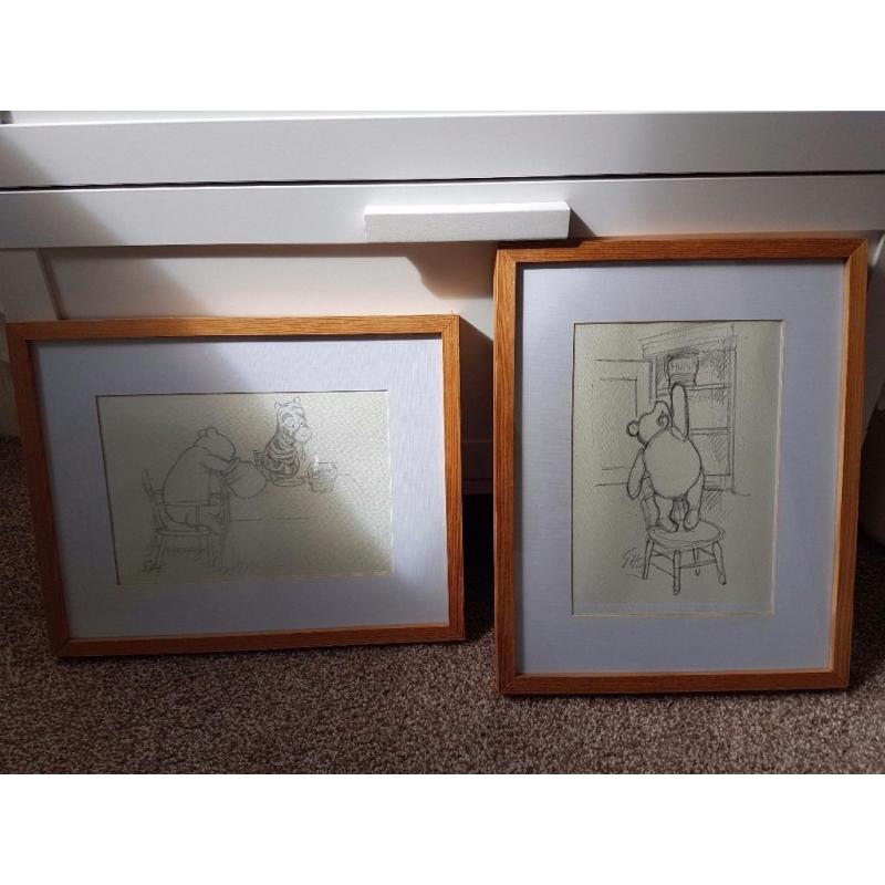 2 winnie poo drawings in frames