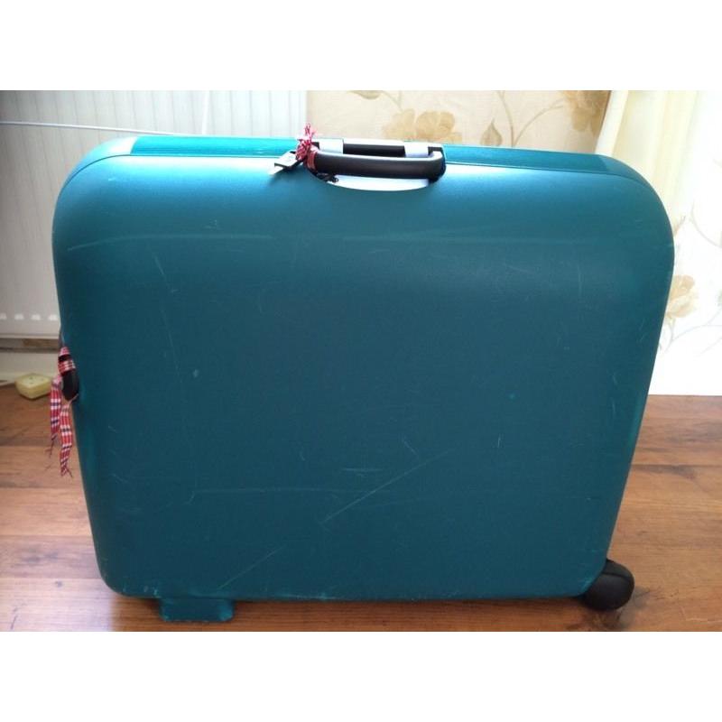 Green Carlton hard shell wheeled suitcase.