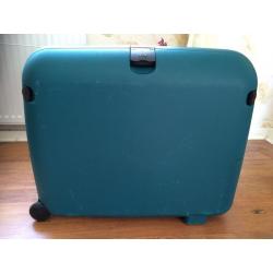 Green Carlton hard shell wheeled suitcase.