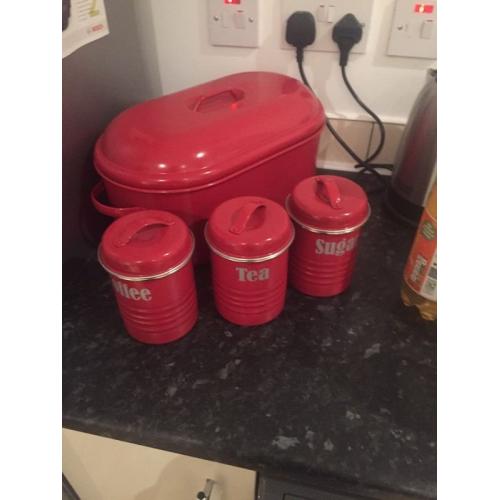 Red bread bin and coffee,tea & sugar tins