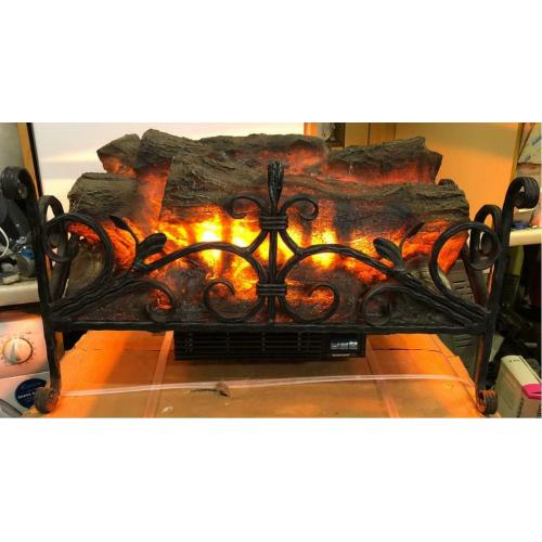 Old fashioned wrought iron log effect fire heater