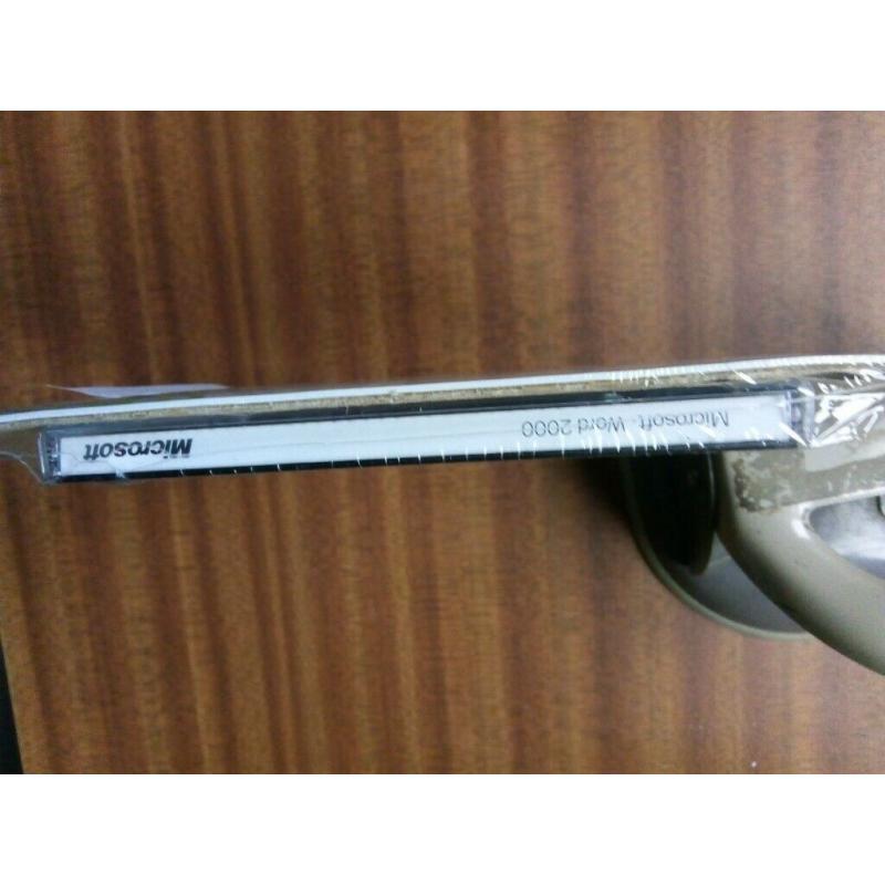 Microsoft Discovering Word 2000, never unpacked still in sealed wrapping with Product key.