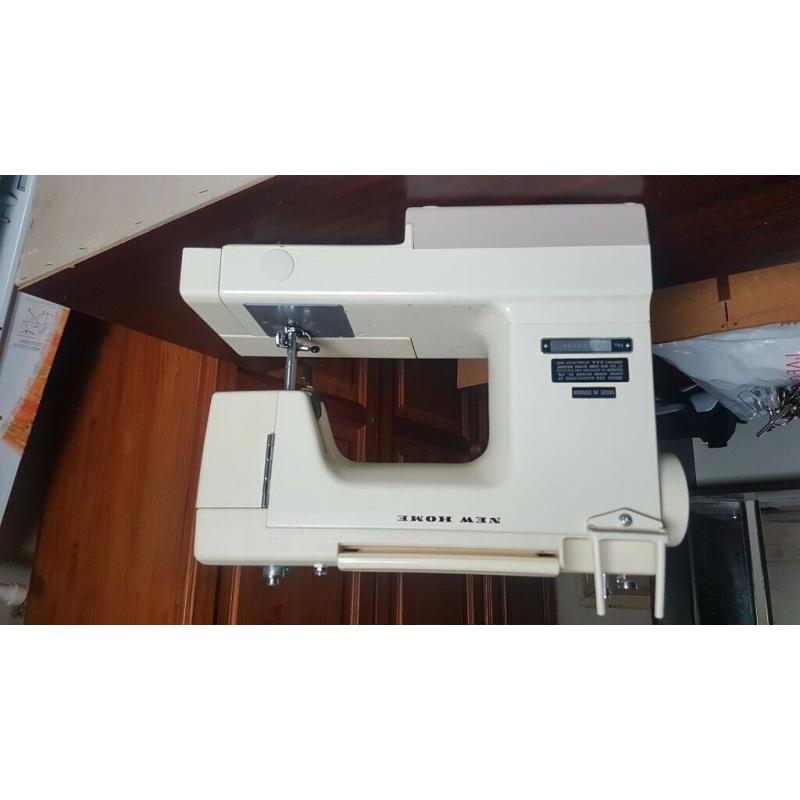 New home cream colour sewing machine ?40