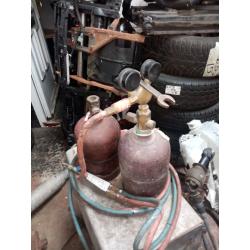 TWO SETS OF GAS BOTTLES