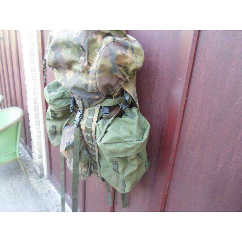 Rucksack and frame long convoluted back zipped on pockets with lots of other pockets can post out