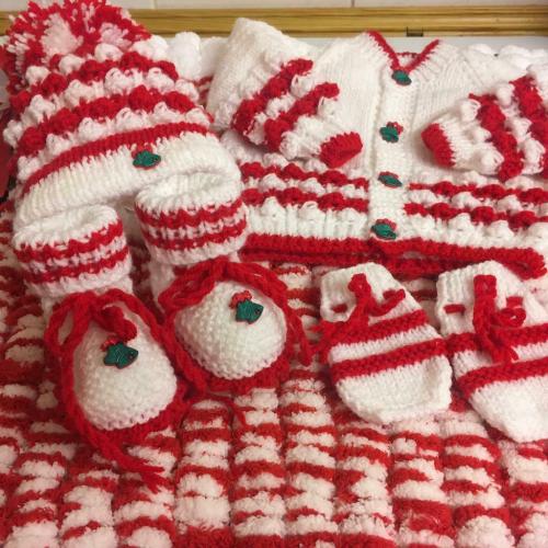 Hand knitted baby?s bundle first size very festive