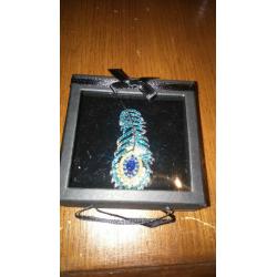 peacock feather brooch