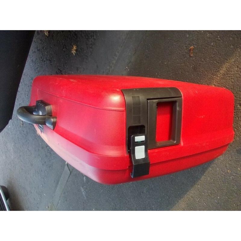 Delsey Hard shell Suitcase in Red With Combination lock